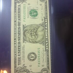 Source Unknown Green and Black Dollar Bill
